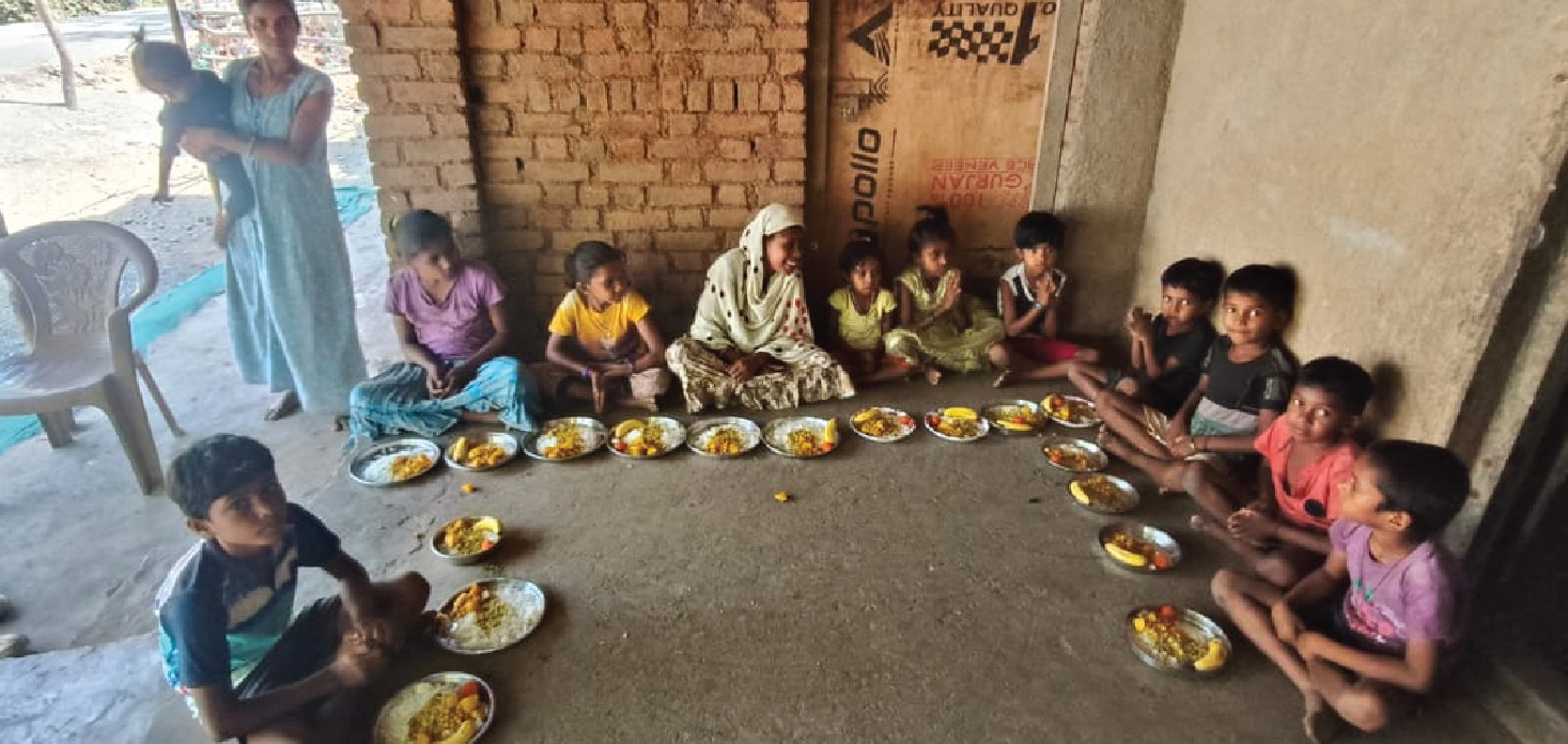 Children seated for an Annadanam meal at Kadupada